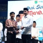 Bupati Tanbu Buka Aksi Sinergitas Merah Putih di Kecamatan Satui